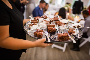 Chocolate cake platter delivering server holding