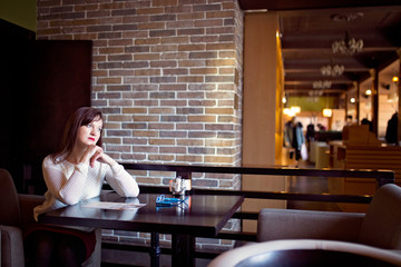 young woman in a cafe