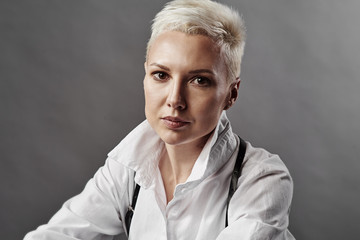 Beautiful girl in a shirt with short hair.