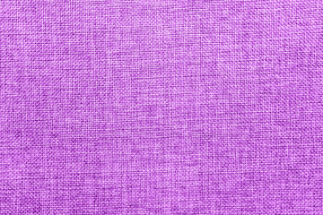 Burlap background colored in purple and white mix