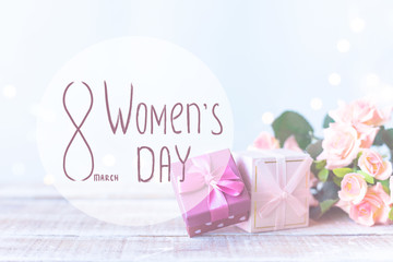 The phrase Women's Day on the background of the Boxes with gifts, a bouquet of flowers on bright blue
