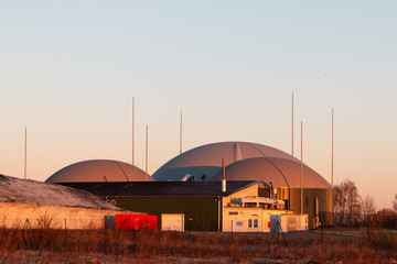 Biogas plant at sunrise or sunset