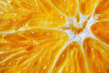 Macro orange background. Ripe, juicy citrus close-up