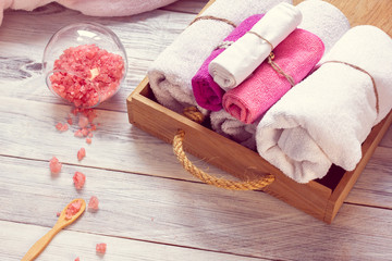 Fototapeta na wymiar Pink set of bathhouse accessories for SPA