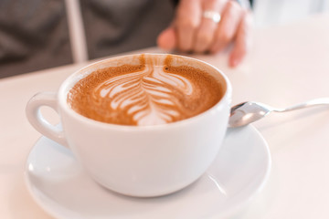 A cup of mokka coffee on wooden white table