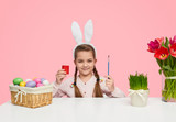Confident girl prepared to color eggs 