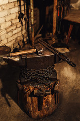 blacksmith workplace: anvil, hammers, blacksmith tongs