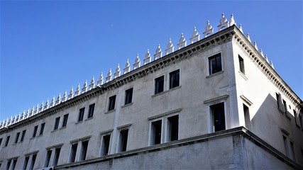 Fototapeta na wymiar Venice, Italy, T Fondaco dei Tedeschi, a fragment of the upper floors
