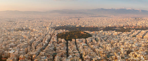 Fototapeta premium Aerial sunset birds eye view in sunlight taken from Lycabettus hill of Athens city, Greece