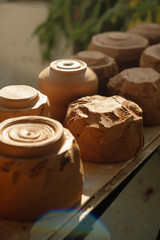 Close-up raw clay pottery chawan tea bowls drying in the sun
