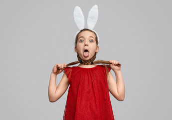 Funny girl in bunny ears choking with braids 
