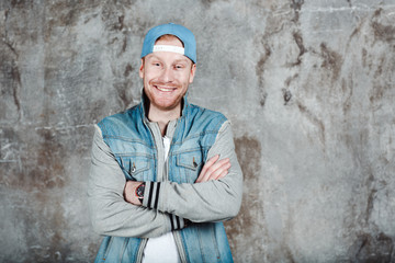 Male in a baseball cap and a denim jacket