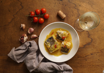 bacalao al pil pil, salted cod in emulsified olive oil sauce, spanish cuisine, basque country     