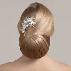 Portrait Of Beautiful Young Blond Woman With Bun Hairstyle