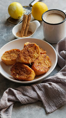 Traditional homemade Spanish torrijas grey stone background. Top view copyspace. Easter dessert 