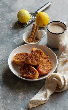 Traditional homemade Spanish torrijas grey stone background. Top view copyspace. Easter dessert 