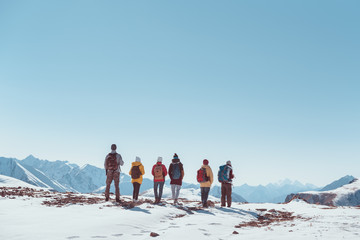 Big group hikers tourists friends mountain pass or top