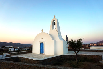 Small church in the country of Mykonos at sunset