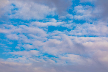 Light white fluffy clouds at morning sky