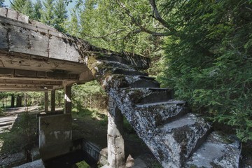 Old concrete stairs in the ruins of the factory.