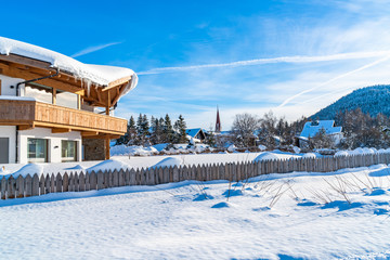 Beautiful winter landscape with snow covered houses and Alps in Seefeld in the Austrian state of Tyrol. Winter in Austria