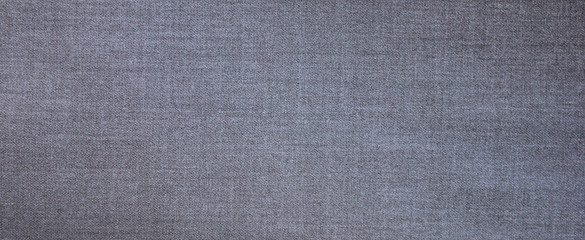 Fototapeta na wymiar Gray fabric texture background top view banner. Classic grey cloth empty canvas, seamless casual smooth silky fashion material, flat lay wallpaper. Gray pattern fabric wide banner