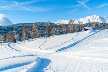 Fototapeta na wymiar Winter landscape with with snow covered Alps and ski track in Seefeld in the Austrian state of Tyrol. Winter in Austria