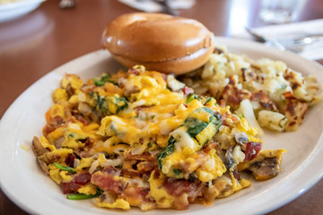 Scrambled Eggs with bacon, spinach and bagel