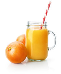 Obraz na płótnie Canvas Freshly squeezed orange juice in glass mason jar with straw. Fresh orange fruits. Natural organic drink for healthy eating and healthy lifestyle. Isolated on white bckground. Clipping path included.