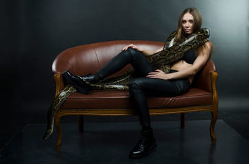 Fototapeta na wymiar sexy woman and python in studio