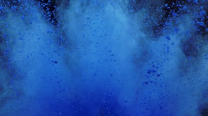 Explosion of colored powder on black background