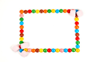 Frame of various colorful candy on white background.