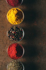 The Different Spices. Spices on stone background.