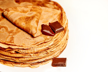 pancakes with chocolate on white background