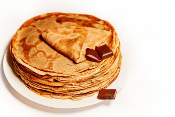 pancakes with chocolate on white background
