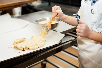Young children make dough products. Hands closeup