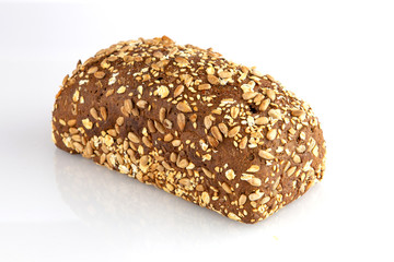 Swedish bread with sunflower and sesame seeds isolated on white background