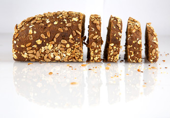 Swedish bread with sunflower and sesame seeds isolated on white background