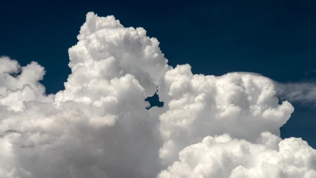 White clouds and blue sky. Time lapse background. UHD 4K