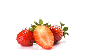 Half two whole strawberries isolated on white background