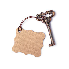 Concept of new life, dream or house with vintage key and mockup empty tag
