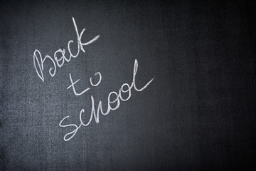 Lettering back to school on black chalkboard