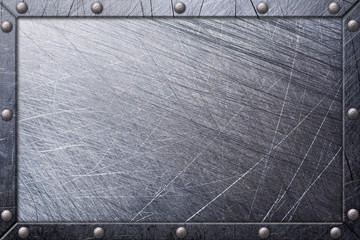 Gray grunge scratched metal nameplate in frame on rivets