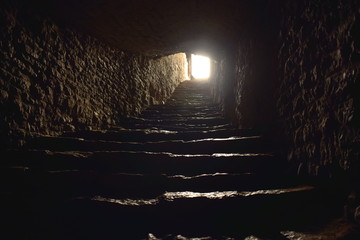 Light at the end of a tunnel with steps
