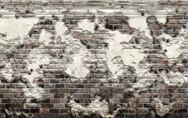 destroyed building wall with bullet holes 