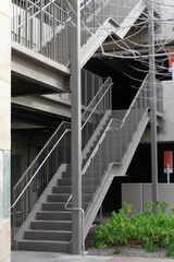 Outdoor steel and concrete stairs to of parking garage