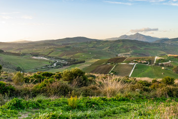 landscape of green rural hills of Sicily, countryside of Italy