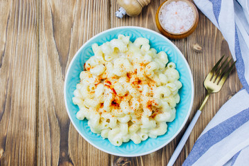 Mac and cheese, american style macaroni pasta with cheesy sauce