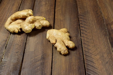 rhizome of ginger on a wooden background