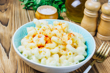 Mac and cheese, american style macaroni pasta with cheesy sauce